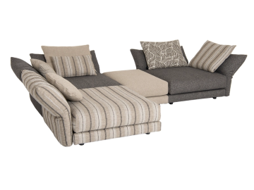 Modulares Sofa-Ensemble in Beige- und Grautönen mit gestreiften und gemusterten Kissen.